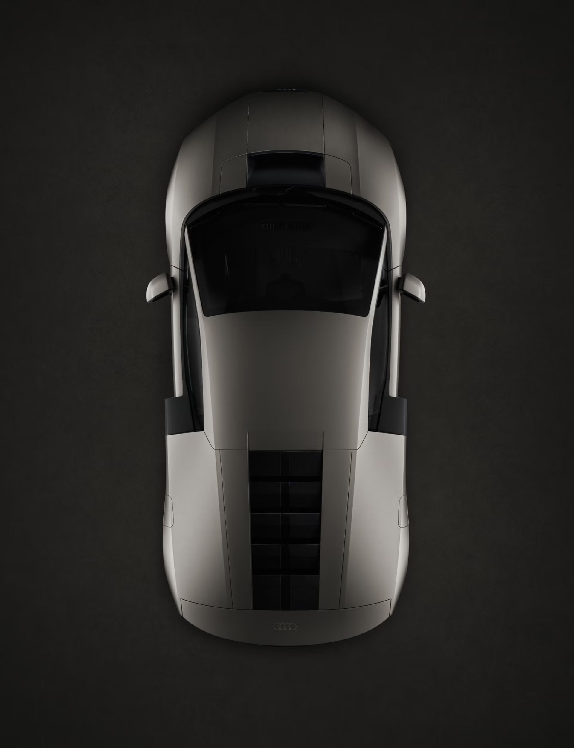 Draufsicht auf den Audi Nuvolari, die seine markante Karosserieform und die Proportionen des Mittelmotors hervorhebt.